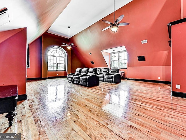 interior space featuring hardwood / wood-style flooring, vaulted ceiling, a wealth of natural light, and ceiling fan