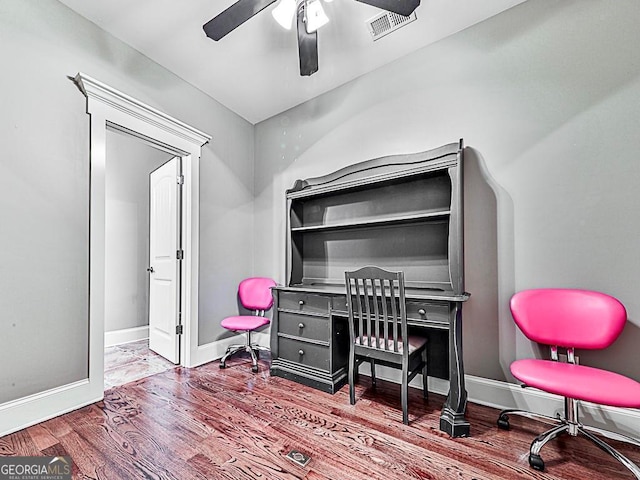 office space with ceiling fan, baseboards, and wood finished floors