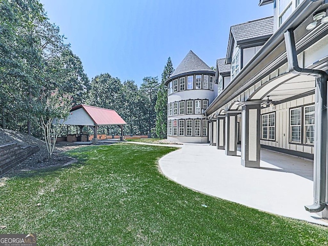 view of yard featuring a patio area, a gazebo, and a balcony