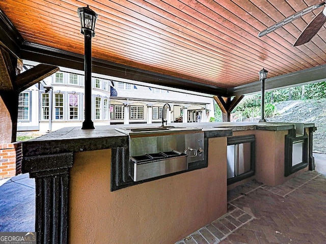 view of patio / terrace with exterior kitchen and exterior bar