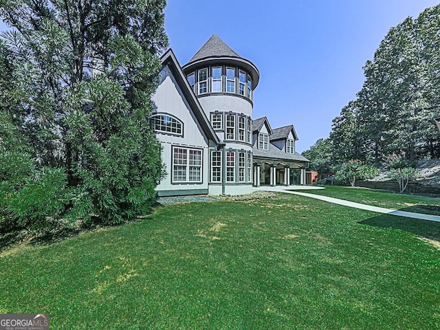 back of property with a yard