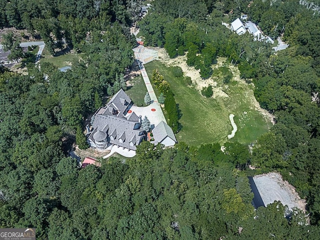 aerial overview of property's location featuring a forest
