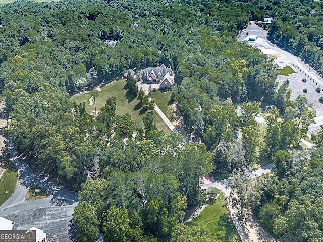 aerial view of property's location with a forest