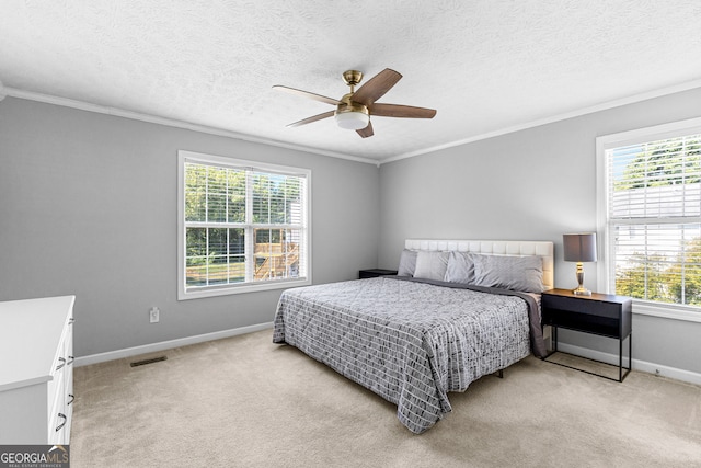 bedroom featuring multiple windows, ceiling fan, and light carpet