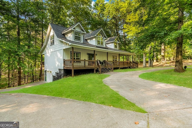 view of front of home with covered porch and a front yard