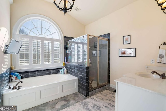 bathroom with vanity, plenty of natural light, and shower with separate bathtub