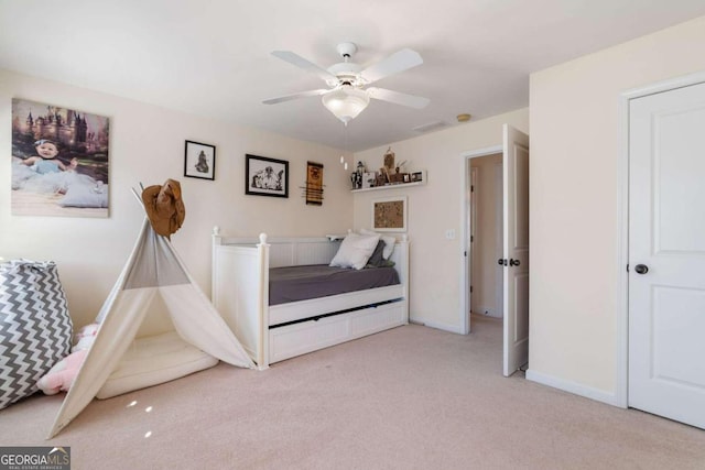 unfurnished bedroom with light carpet and ceiling fan