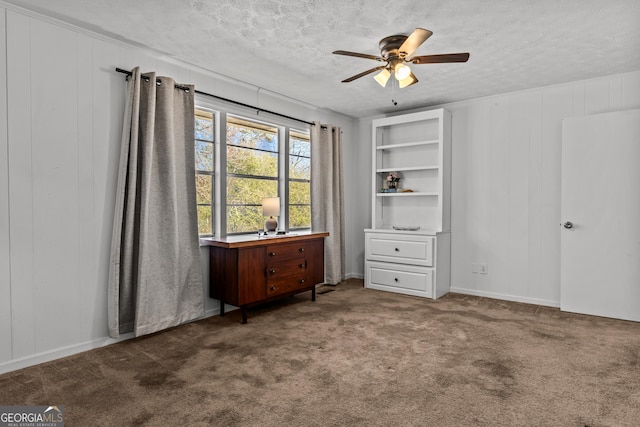 bedroom featuring ceiling fan, carpet flooring, and a textured ceiling