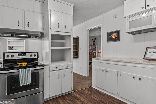 kitchen featuring dark hardwood / wood-style floors, white cabinets, a textured ceiling, and electric stove