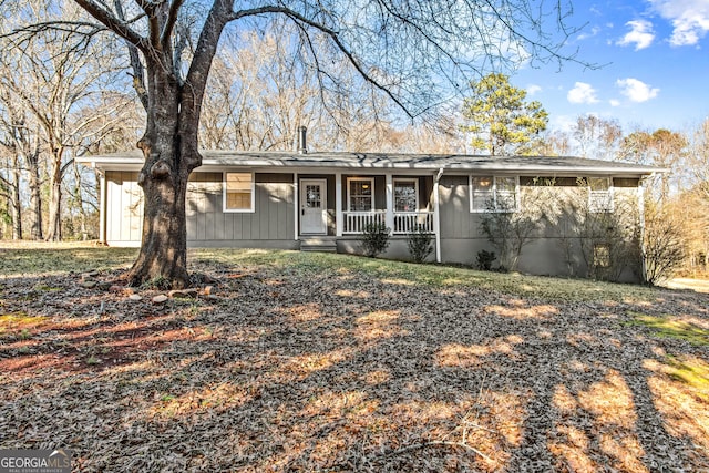 single story home featuring covered porch