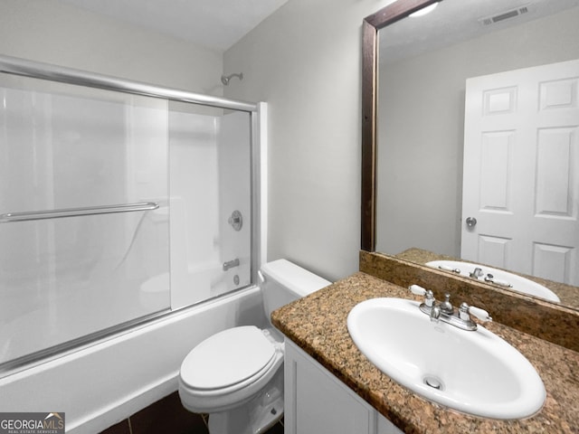 full bath with enclosed tub / shower combo, visible vents, vanity, and toilet