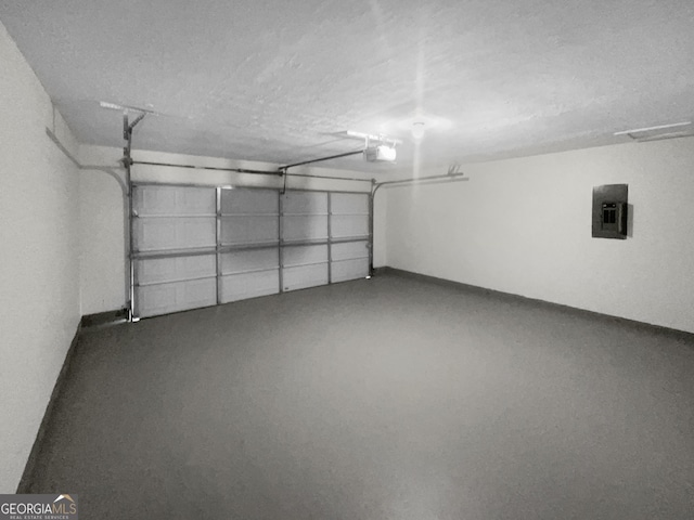 garage with electric panel and a garage door opener