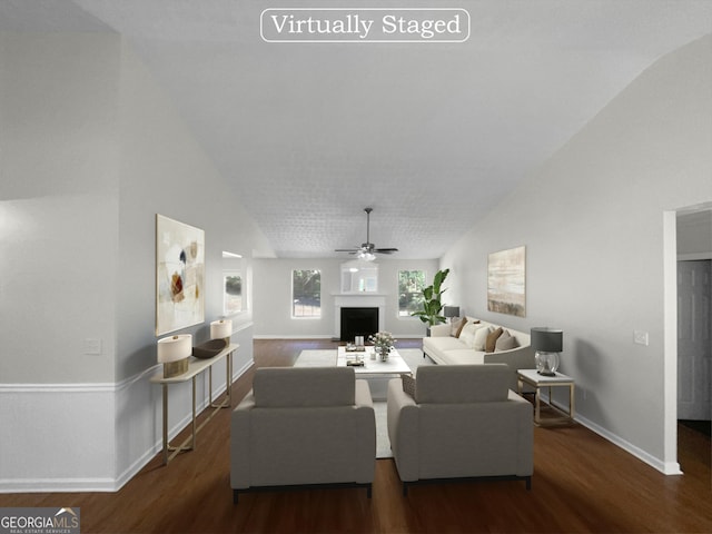 living room with a fireplace, wood finished floors, a ceiling fan, and baseboards