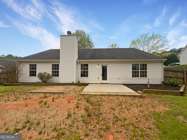 back of property with a patio area