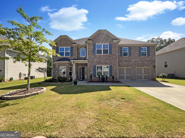 view of front of house featuring a garage, driveway, cooling unit, a front lawn, and brick siding