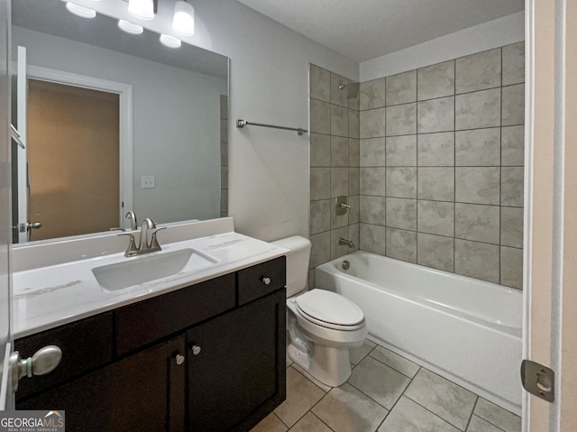 bathroom featuring toilet, vanity, washtub / shower combination, and tile patterned floors