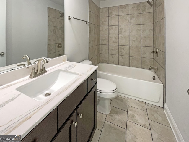 bathroom with toilet, vanity, shower / tub combination, tile patterned flooring, and baseboards