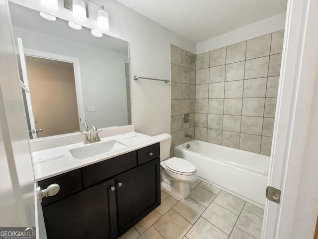 bathroom with tile patterned flooring, bathtub / shower combination, vanity, and toilet