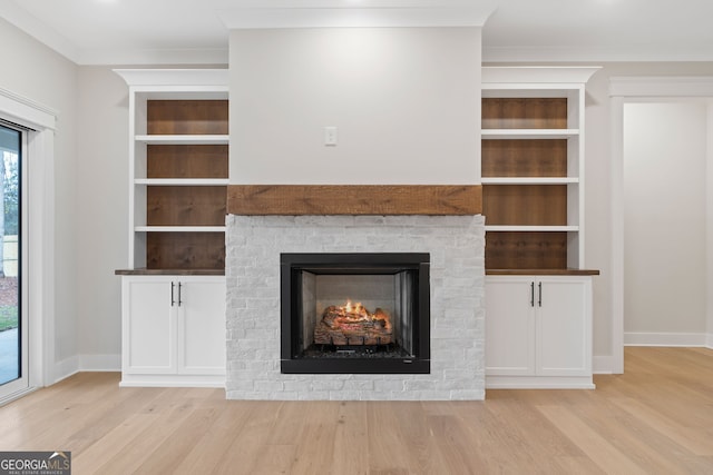 interior details featuring hardwood / wood-style floors and built in shelves