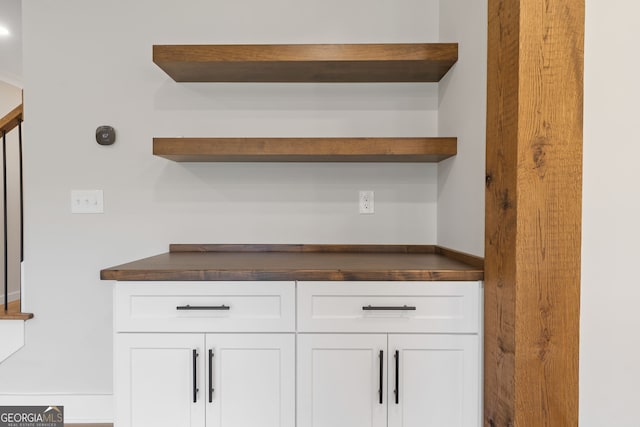 bar featuring white cabinetry