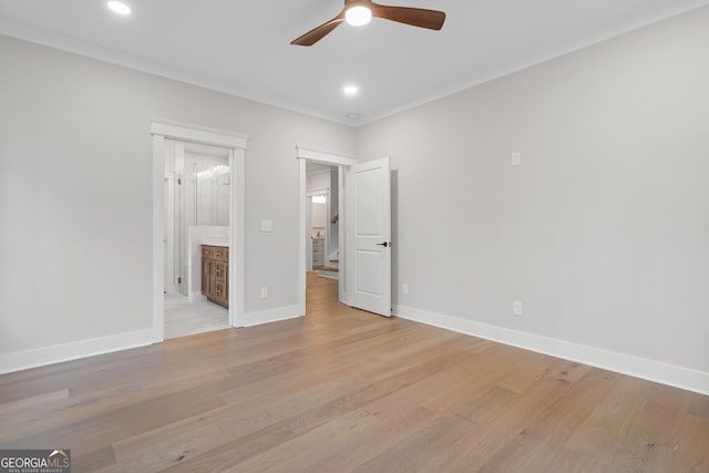 unfurnished bedroom with ensuite bath, light hardwood / wood-style flooring, and ceiling fan