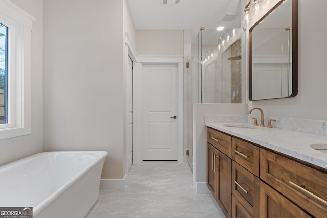 bathroom featuring vanity and shower with separate bathtub