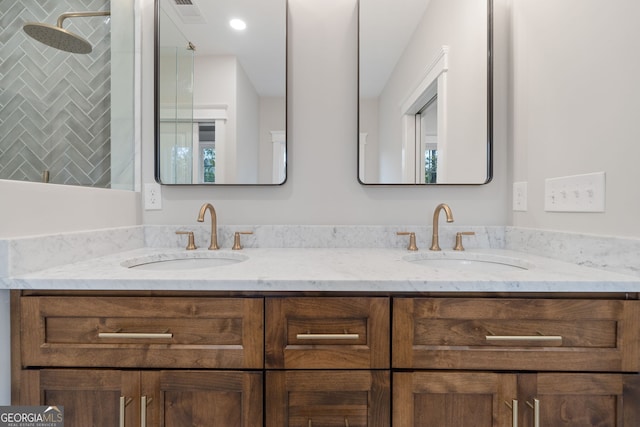 bathroom featuring vanity and a tile shower