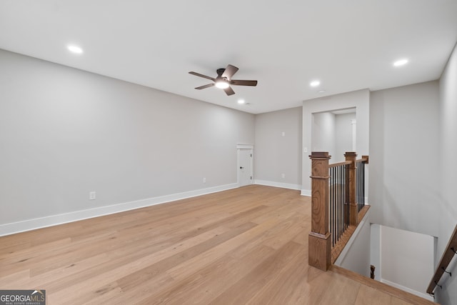 interior space with light hardwood / wood-style flooring and ceiling fan