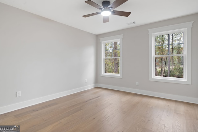 unfurnished room featuring ceiling fan and light hardwood / wood-style flooring