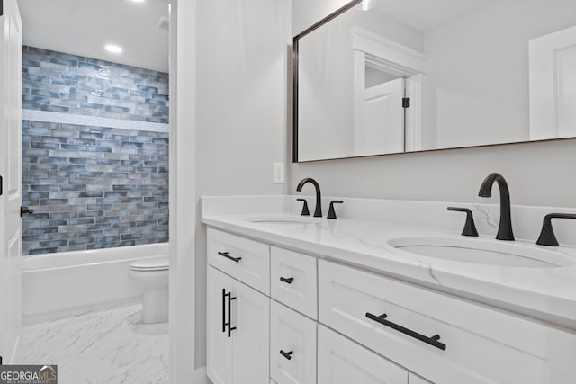 full bathroom with vanity, toilet, and tiled shower / bath