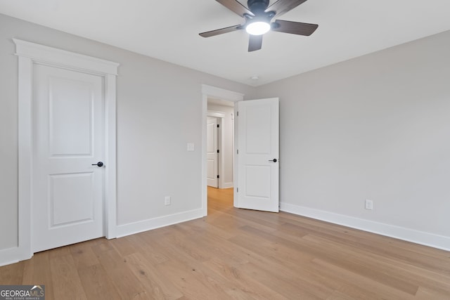 unfurnished bedroom featuring ceiling fan and light hardwood / wood-style flooring