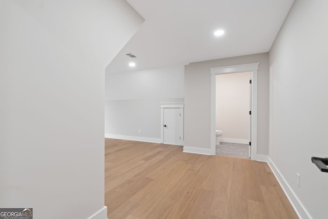 spare room featuring light hardwood / wood-style flooring