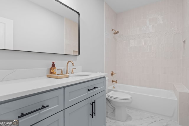 full bathroom with vanity, toilet, and tiled shower / bath