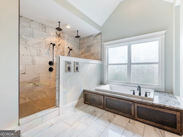 bathroom with lofted ceiling and independent shower and bath