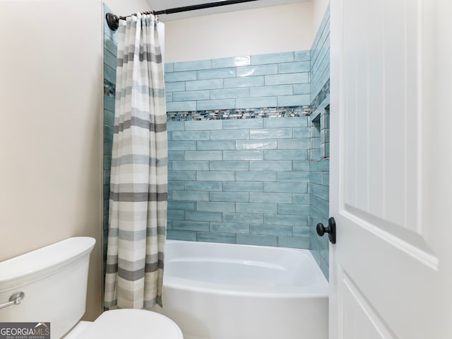 bathroom featuring toilet and shower / tub combo