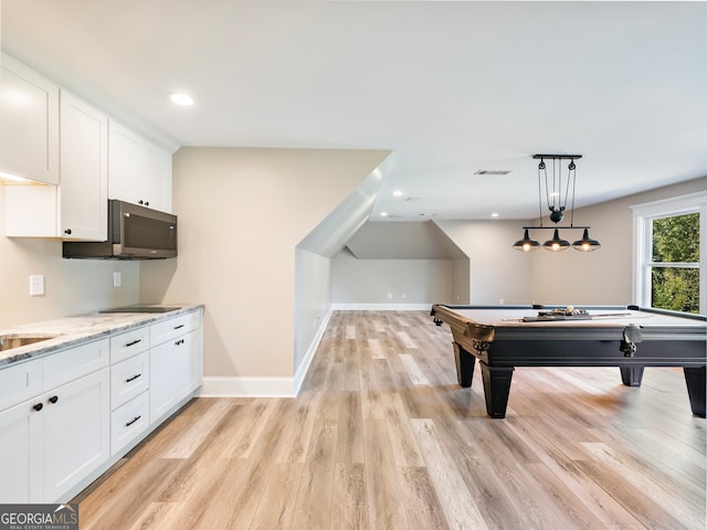 playroom with light hardwood / wood-style flooring and pool table