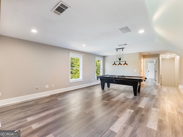 game room with vaulted ceiling, pool table, and light hardwood / wood-style floors