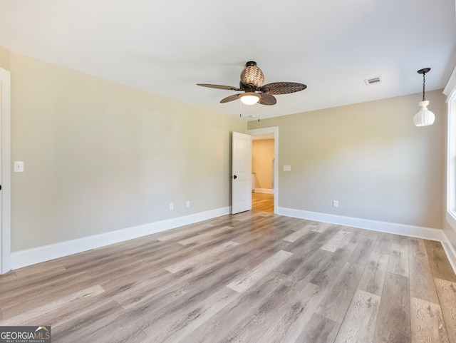 unfurnished room with ceiling fan and light hardwood / wood-style floors