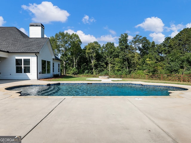 view of swimming pool featuring a patio area