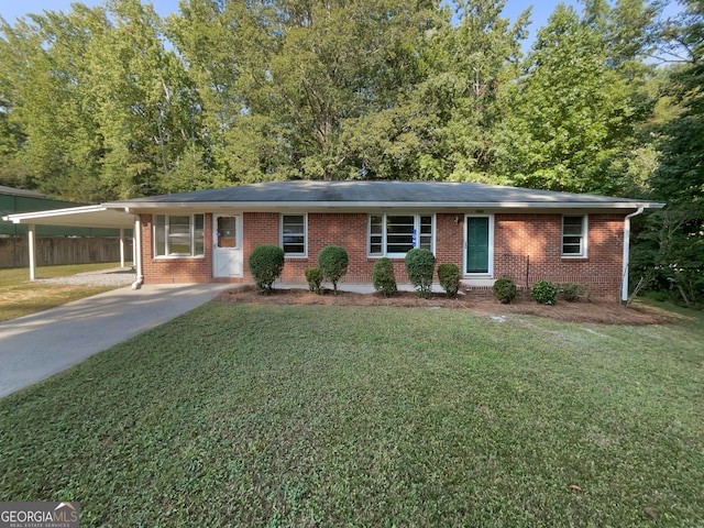 ranch-style home with a carport and a front lawn