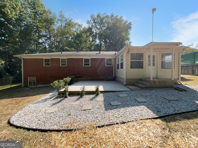 back of property featuring a patio