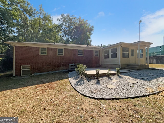 back of house with a patio area and central AC