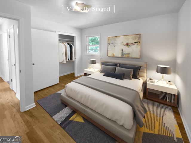 bedroom with light wood-type flooring and a closet