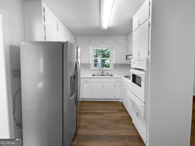 kitchen with stainless steel fridge with ice dispenser, white oven, dark hardwood / wood-style flooring, and white cabinetry