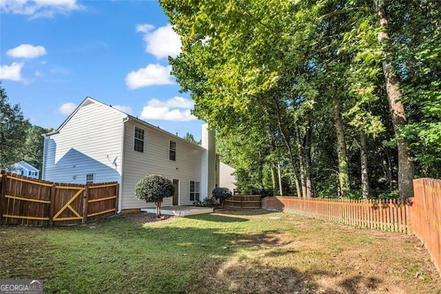 exterior space featuring a yard and a patio