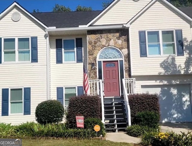 view of exterior entry with a garage