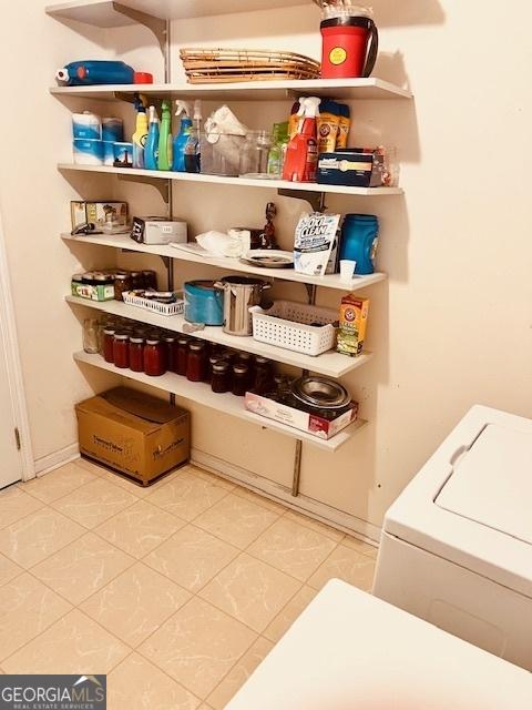 storage area featuring washer / clothes dryer