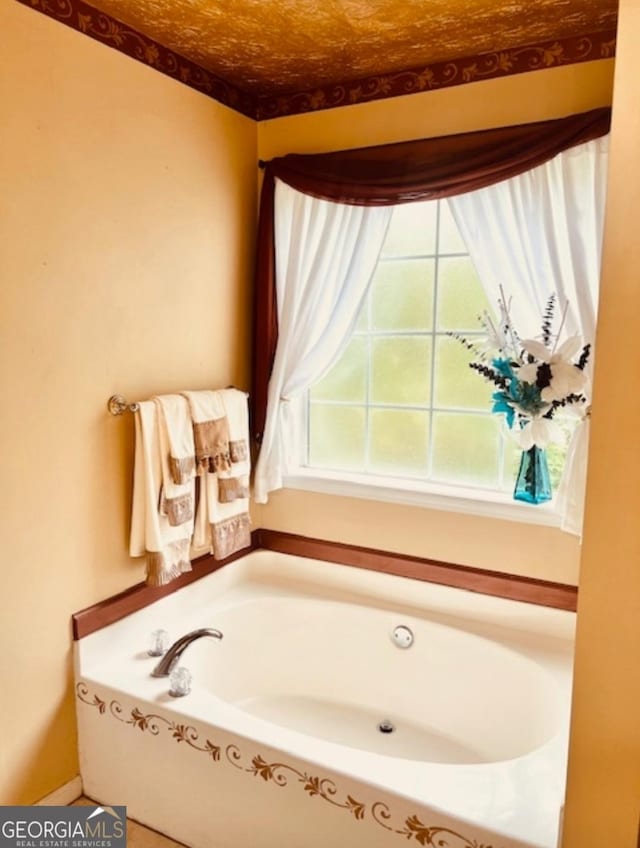 bathroom with a tub