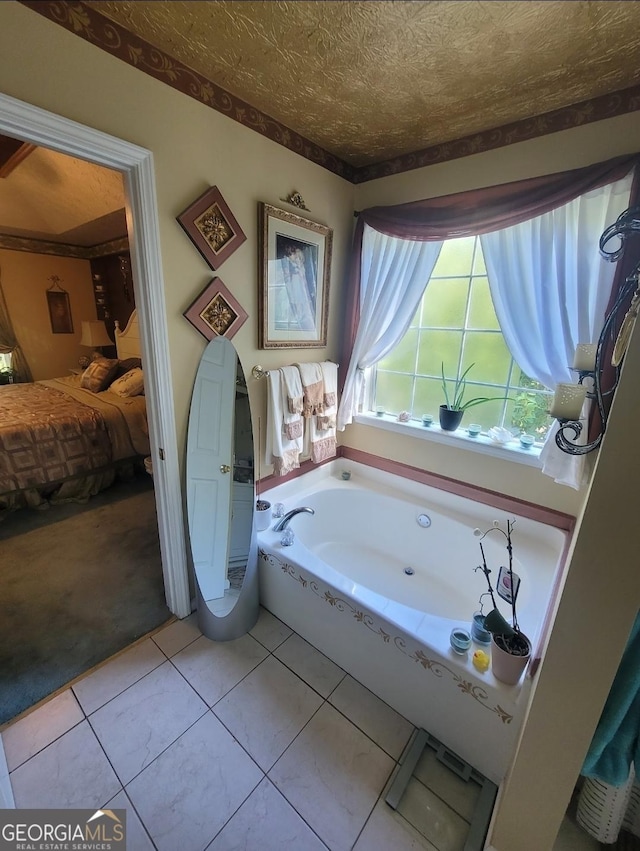 bathroom featuring a bathtub and tile patterned flooring