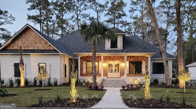 view of front facade featuring a porch and a front yard